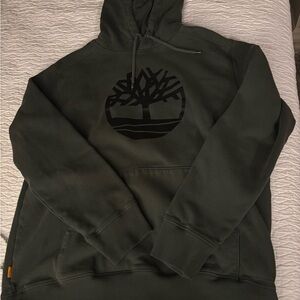 Dark green men’s size XL Timberland hoodie.